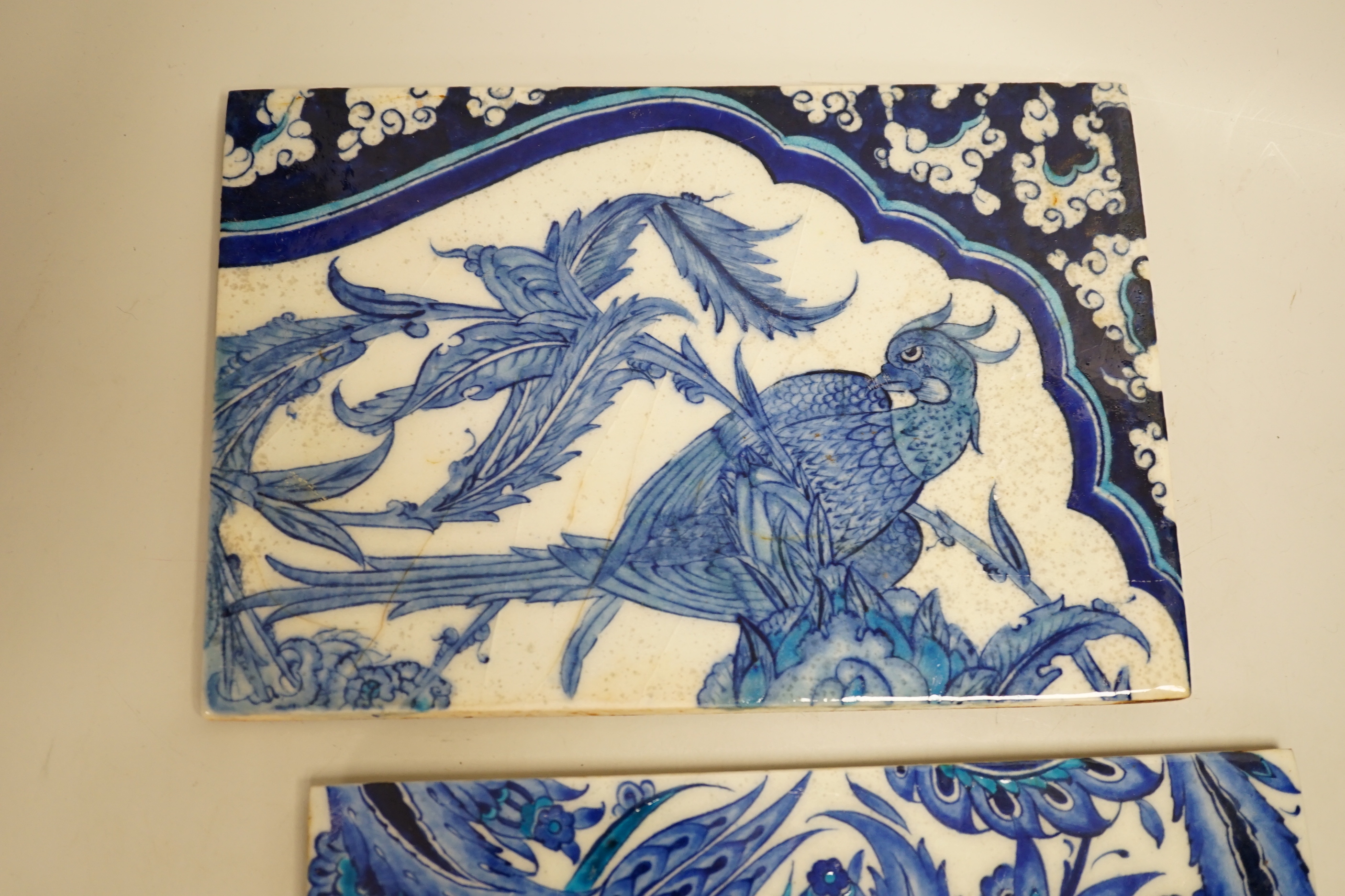 Two Turkish Iznik blue and white tiles, 24cm x 16.4cm